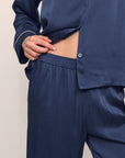 Model is wearing Inez Washable Silk Long PJ Set inNavy/Champagne