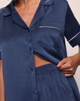 Model is wearing Inez Washable Silk Short PJ Set in Rose Navy/Champagne