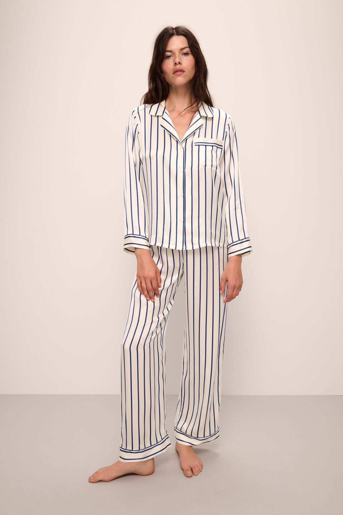 Model wears Inez Washable Silk Printed Long PJ Set in Classic Stripe Ivory/Denim Blue.