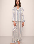 Model wears Inez Washable Silk Printed Long PJ Set in Classic Stripe Ivory/Denim Blue.