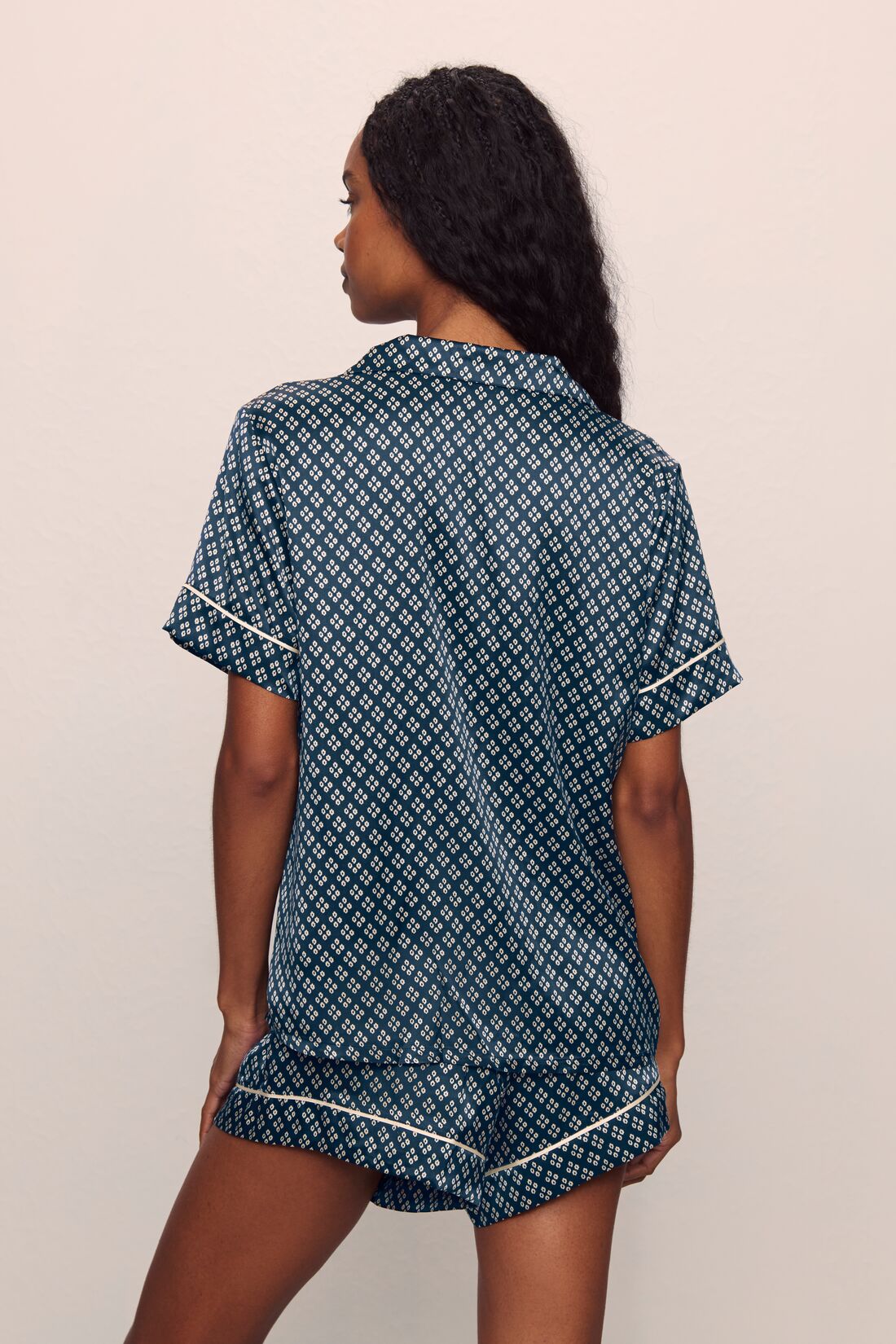 Model is wearing Inez Washable Silk Printed Short Set in Petite batik Navy/Ivory