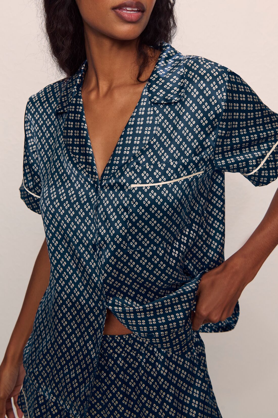 Model is wearing Inez Washable Silk Printed Short Set in Petite batik Navy/Ivory