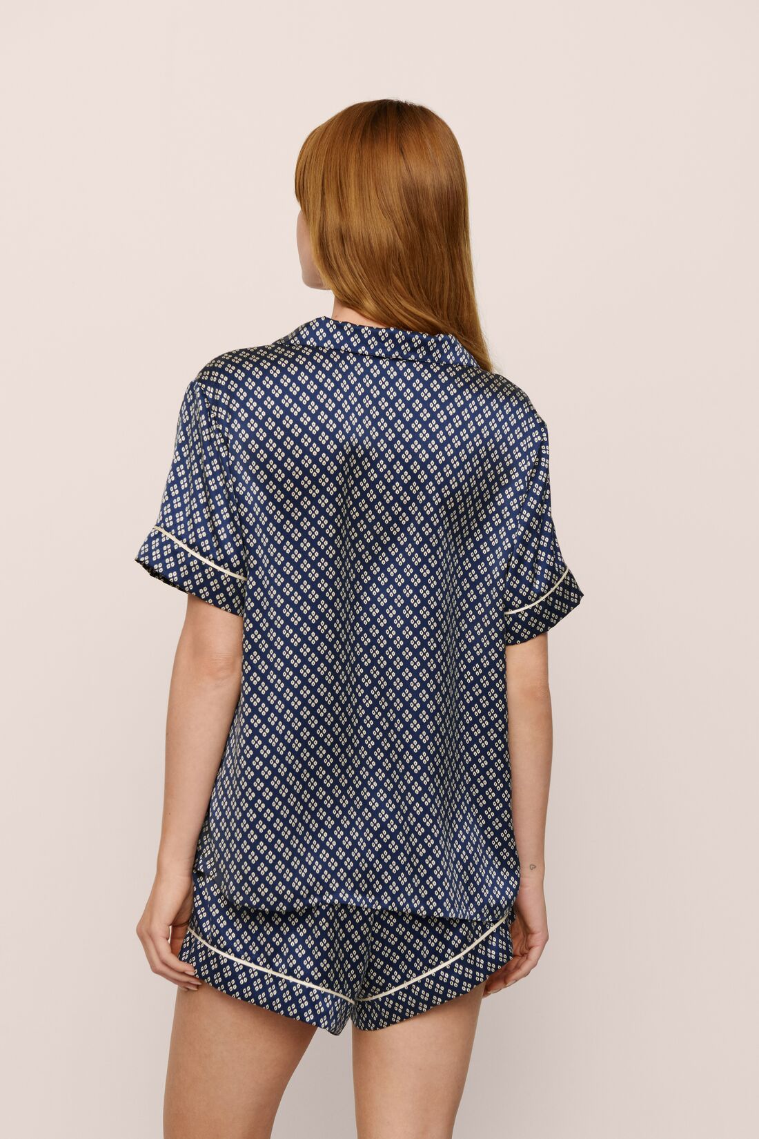Model Is Wearing Inez Printed Short Pj Set In Petite Batik Indigo Blue