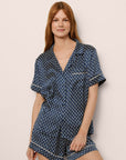 Model Is Wearing Inez Printed Short Pj Set In Petite Batik Indigo Blue