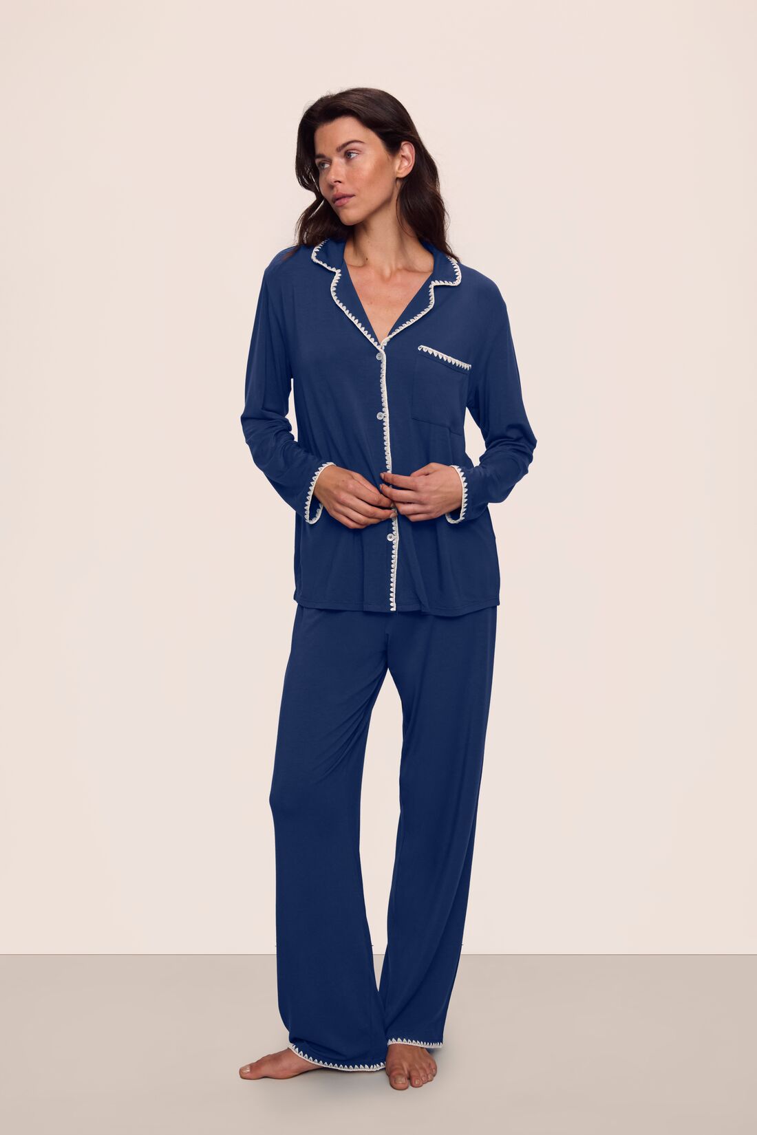 Model is wearing Frida TENCEL™ Modal Long PJ Set in Navy/Ivory