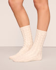 Model wearing cozy socks in ivory