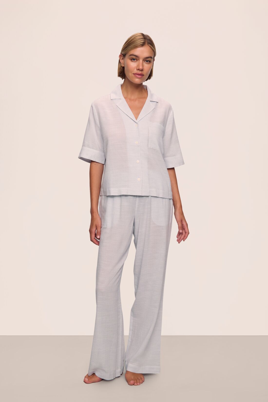 Model is wearing Nautico Long PJ Set in Feeder Stripe White/Peppercorn