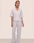 Model is wearing Nautico Long PJ Set in Feeder Stripe White/Peppercorn
