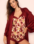 Model is wearing Washable Silk Printed Cami and Short Set and Long Robe in Botanical Flower Merlot and Merlot