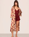 Model is wearing Inez Washable Silk Long Robe in Botanical Flower Merlot and Washable Silk Lace Cami and Short Set in Merlot/Merlot