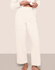 Model wearing recycled boucle pant in ivory