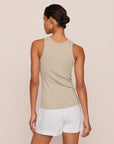 Model is wearing Essential Rib Tank in Beige