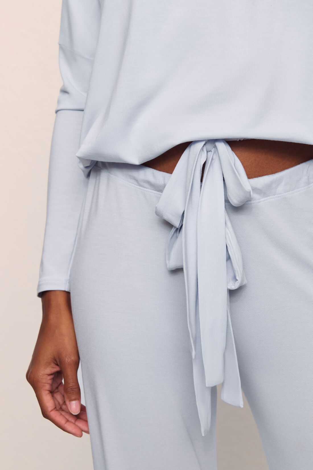 Model is wearing Gisele TENCEL™ Modal Slouchy PJ Set in Navy/Ivory