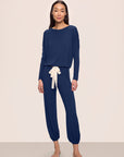 Model is wearing Gisele TENCEL™ Modal Slouchy PJ Set in Navy/Ivory