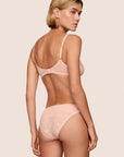 Model is wearing Soft Stretch Lace Bikini in Buff