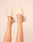 Model is wearing sherpa slipper in ivory