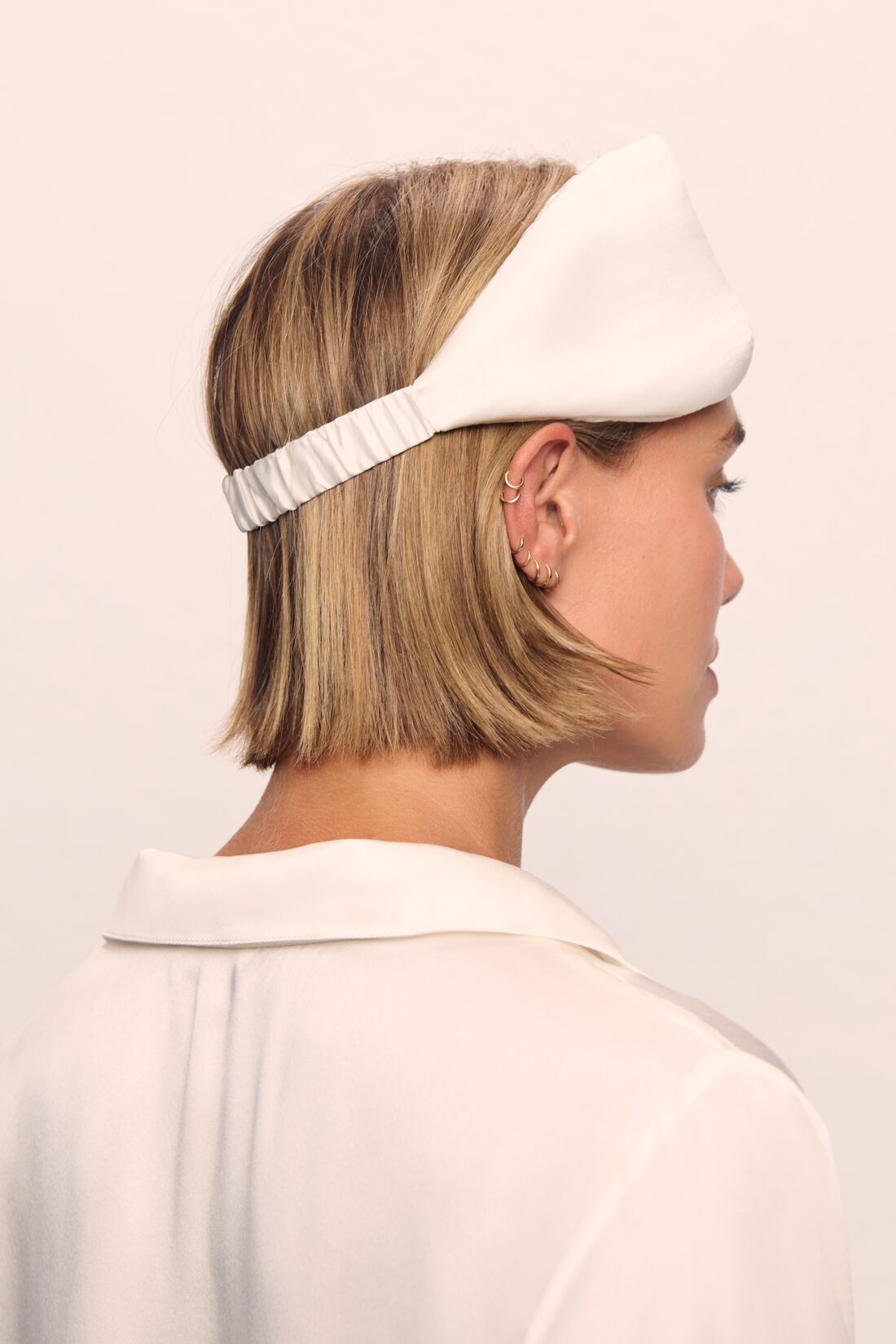 Model is wearing Washable Silk Eye Mask in Ivory