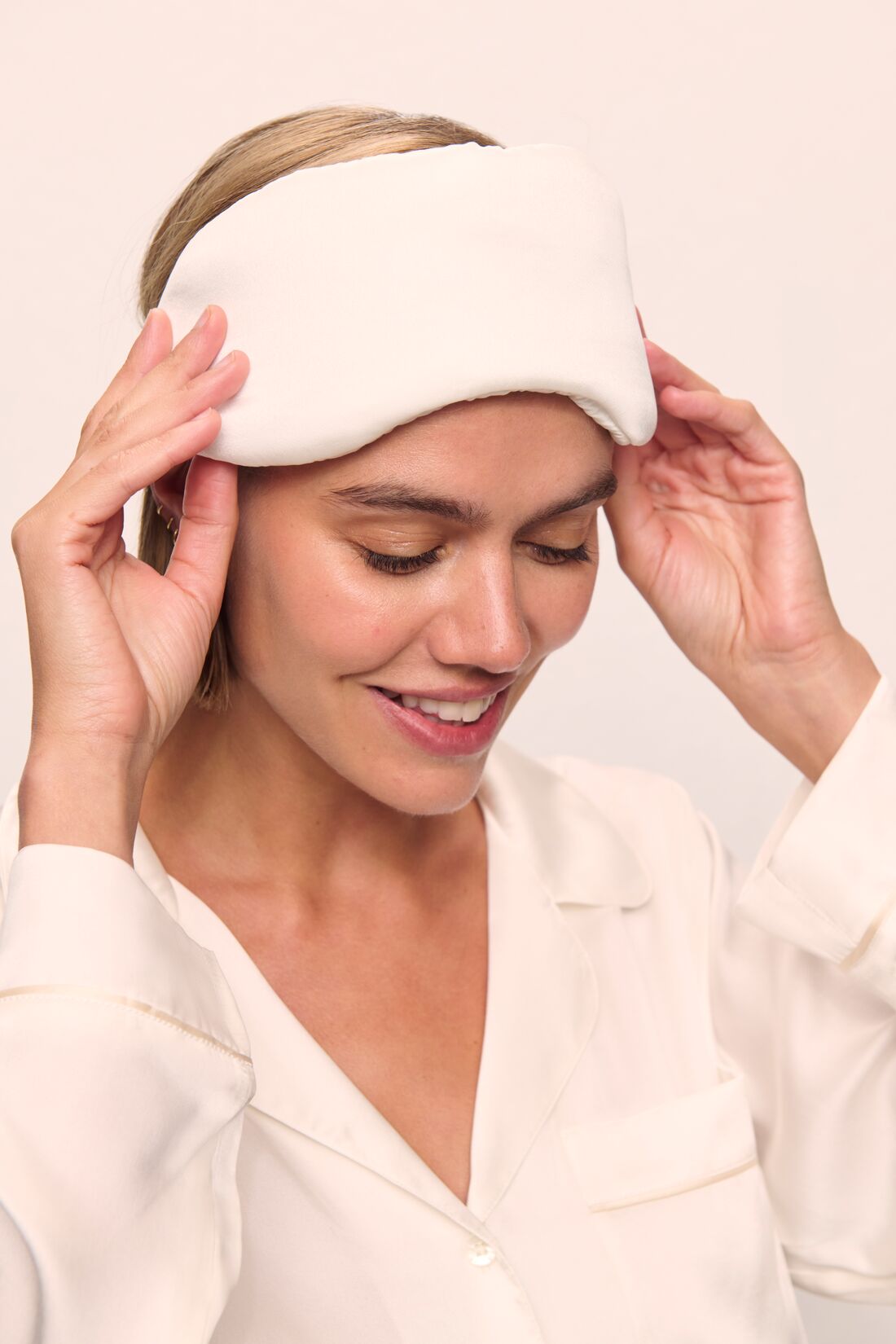Model is wearing Washable Silk Eye Mask in Ivory