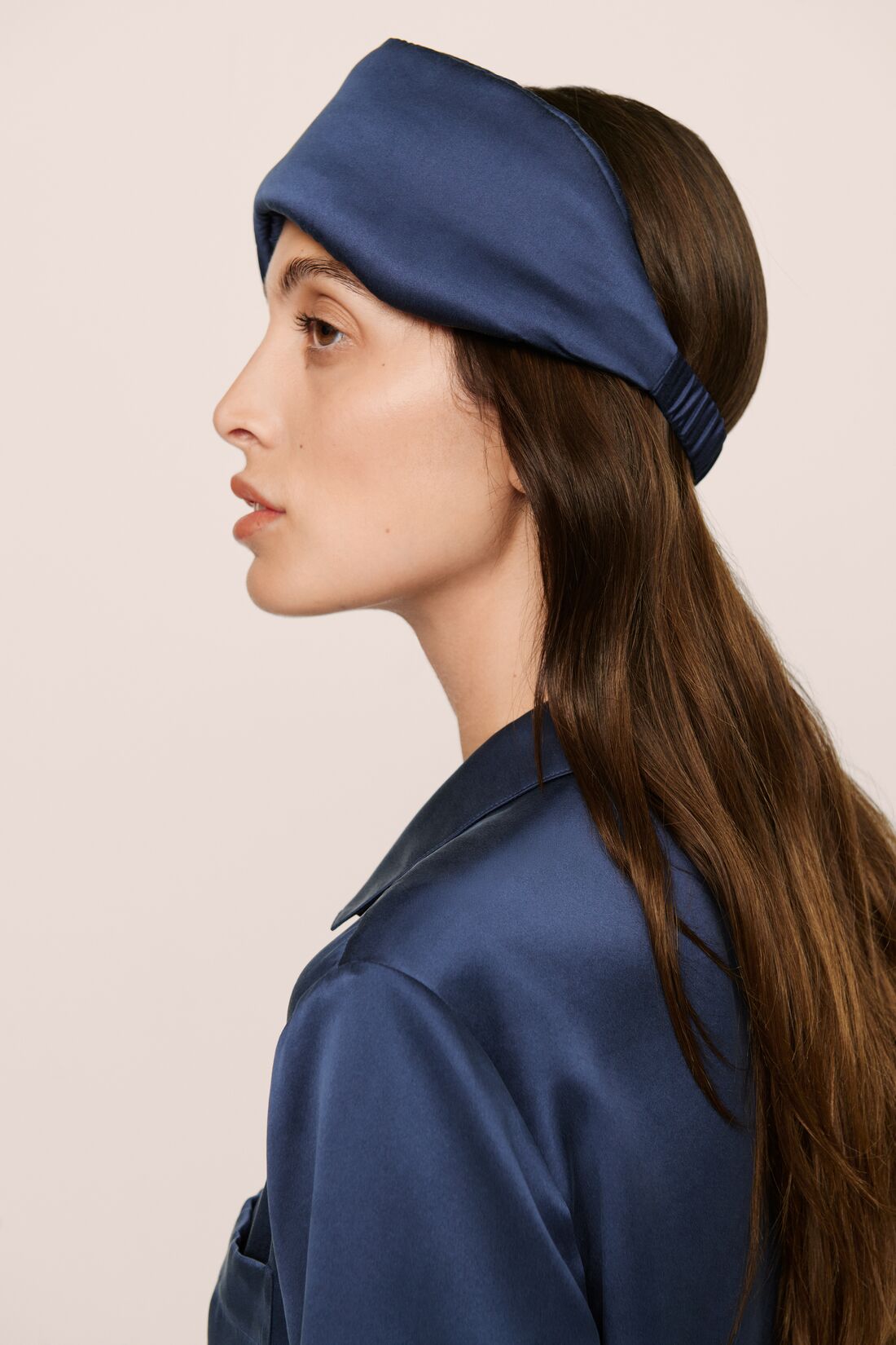 Model Is Wearing Inez Pillow Eye Mask In Navy