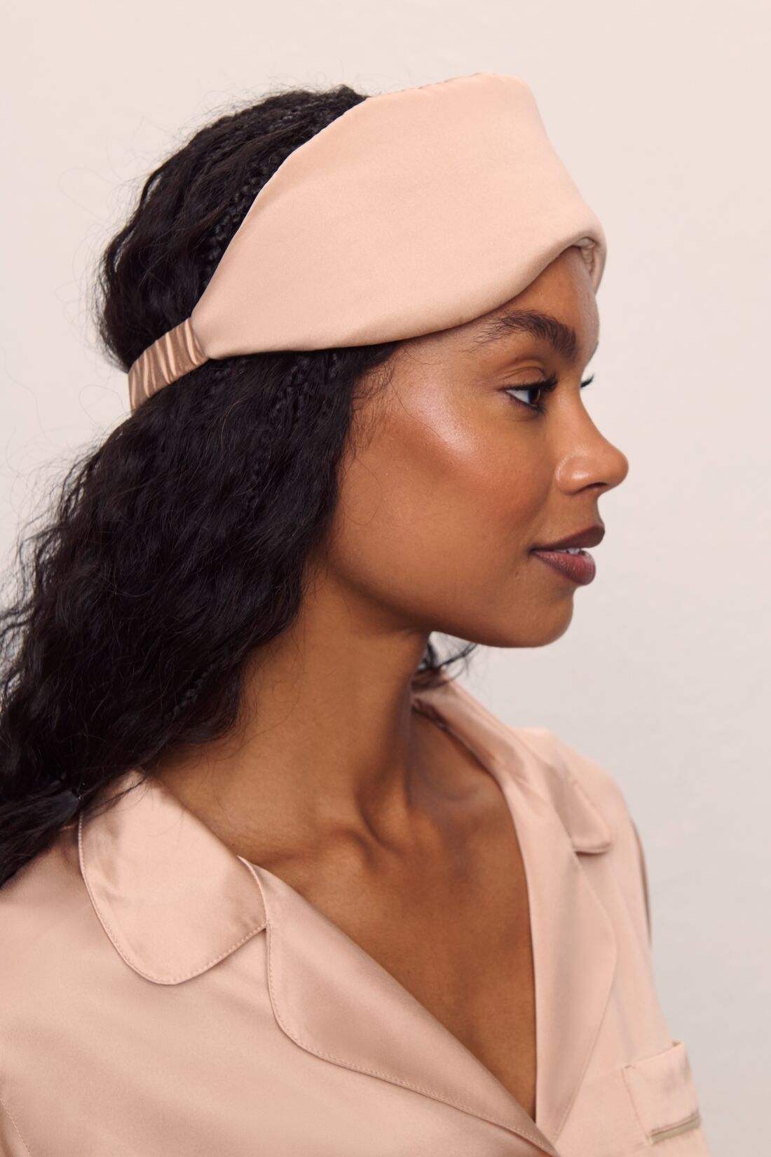 Model is wearing Washable Silk Eye Mask in Rose Cloud