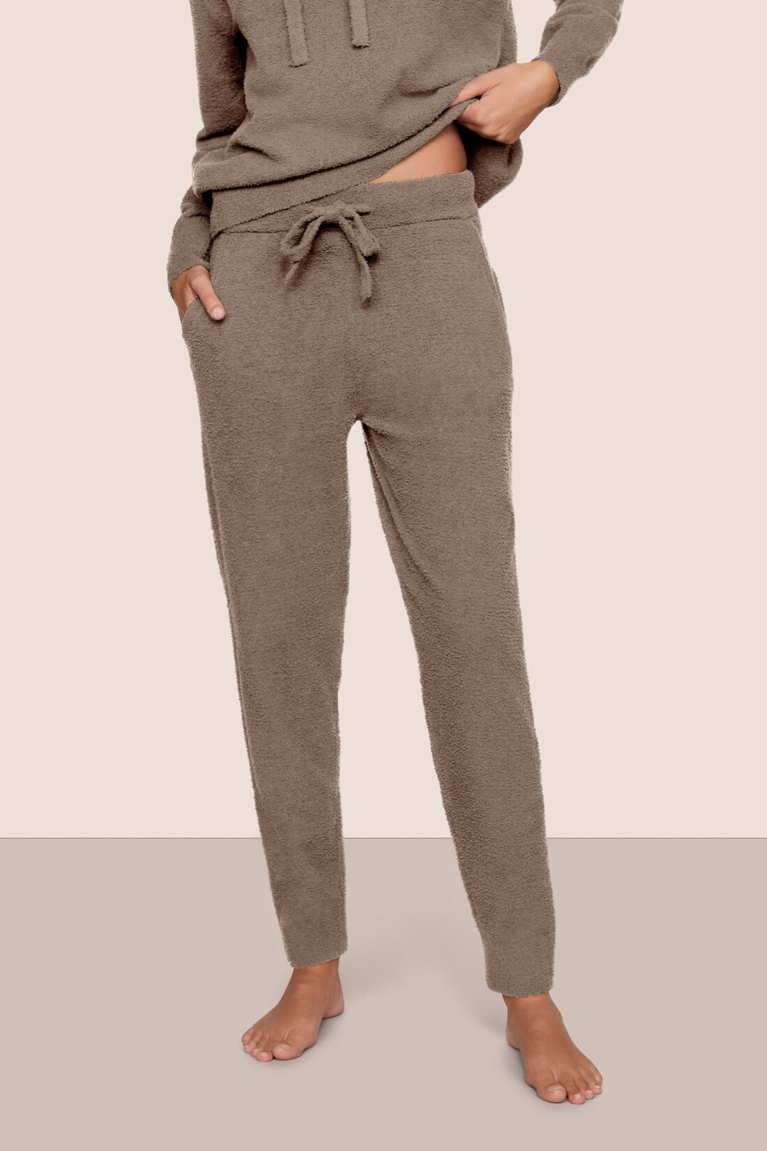 Model is wearing Recycled Boucle Joggers in Deep Taupe