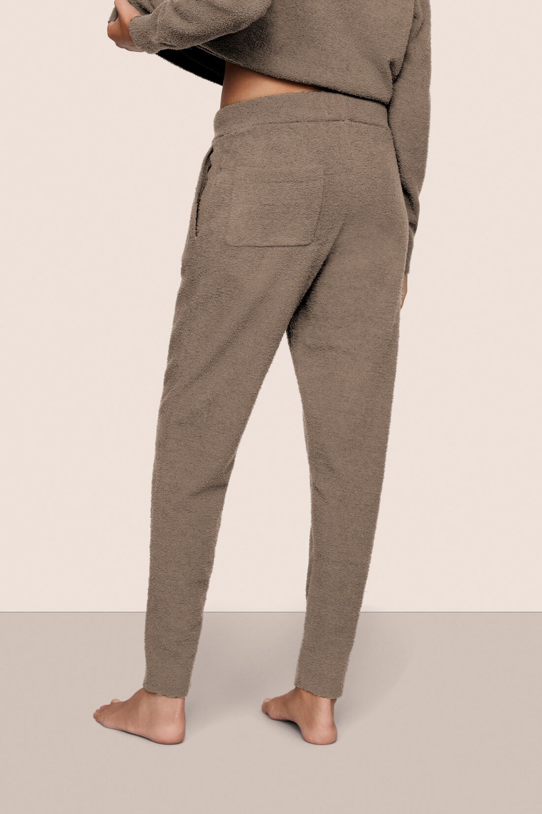 Model is wearing Recycled Boucle Joggers in Deep Taupe