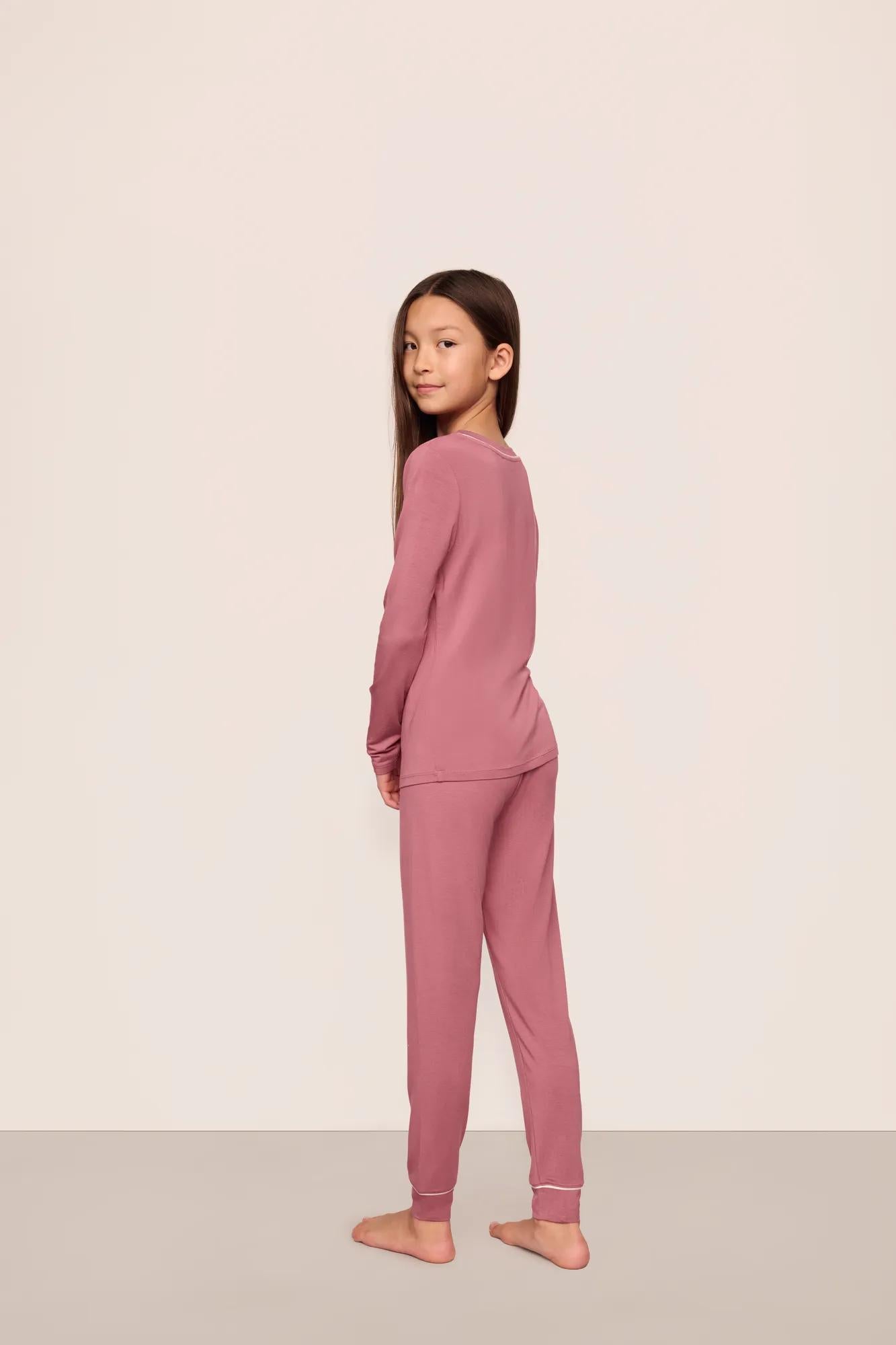 Model is wearing Kids TENCEL™ Modal Unisex Long PJ Set  in  Berry Blush/Ivory