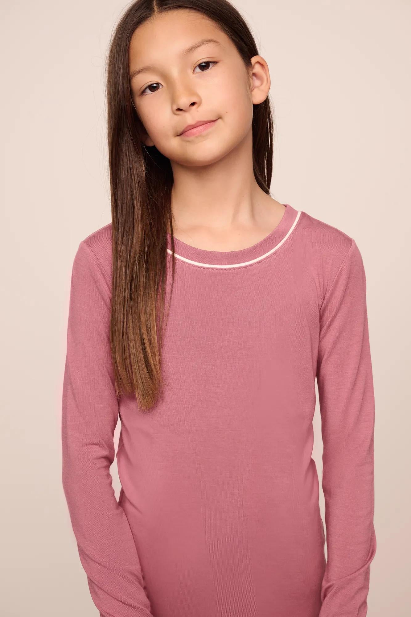 Model is wearing Kids TENCEL™ Modal Unisex Long PJ Set  in  Berry Blush/Ivory