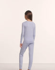 Model is wearing Kids TENCEL™ Modal Unisex Long PJ Set in Lavender Dusk/Ivory