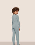 Model is wearing Kids TENCEL™ Modal Unisex Long PJ Set  in Lead/Ivory