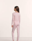 Model is wearing Kids TENCEL™ Modal Unisex Long PJ Set in Pale Pink/Fig