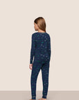 Model is wearing Kids Printed TENCEL™ Modal Unisex Long PJ Set in Forest Pine Navy/Ivory