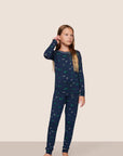 Model is wearing Kids Printed TENCEL™ Modal Unisex Long PJ Set in Forest Pine Navy/Ivory