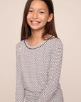 Model is wearing Kids Printed TENCEL™ Modal Unisex Long PJ Set in Geo