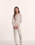Model is wearing Kids Printed TENCEL™ Modal Unisex Long PJ Set in Rose Garden Cameo Pink/Pale Pi