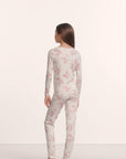 Model is wearing Kids Printed TENCEL™ Modal Unisex Long PJ Set in Rose Garden Cameo Pink/Pale Pi