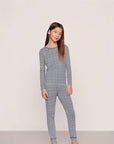 Model is wearing Kids Printed TENCEL™ Modal Unisex Long PJ Set in Seashell Navy/Navy
