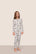 Model is wearing Kids Printed TENCEL™ Modal Unisex Long PJ Set  in Ski Chalet Ivory/Pine