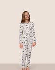 Model is wearing Kids Printed TENCEL™ Modal Unisex Long PJ Set in Ski Chalet Ivory/Pine