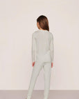 Model is wearing Kids Printed TENCEL™ Modal Unisex Long PJ Set in Tide Dot Ivory/Ivory