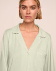 Model is wearing Gisele TENCEL™ Modal Long PJ Set in Mint Cream/Ivory