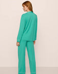 Model is wearing Gisele TENCEL™ Modal Long PJ Set in Oasis Green/White