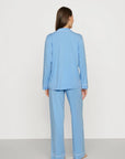Model is wearing Gisele TENCEL™ Modal Long PJ Set in Summer Blue/White