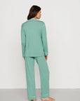 Model is wearing Gisele TENCEL™ Modal Long PJ Set in Seagrass/White