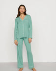 Model is wearing Gisele TENCEL™ Modal Long PJ Set in Seagrass/White