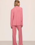 Model is wearing Gisele TENCEL™ Modal Long PJ Set in Sunkissed Coral/Ivory