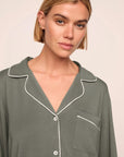 Model is wearing Gisele TENCEL™ Modal Long PJ Set in Smokey Olive/Ivory