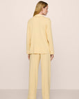 Model is wearing Gisele TENCEL™ Modal Long PJ Set in Sunrise/Ivory