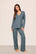Model is wearing Gisele TENCEL™ Modal Long PJ Set  in  Stone Blue/Ivory