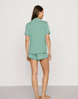 Model is wearing Gisele TENCEL™ Modal Relaxed Short PJ Set in Seagrass/White